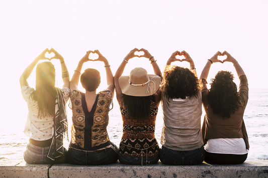 What is Perimenopause group of women sitting on a wall