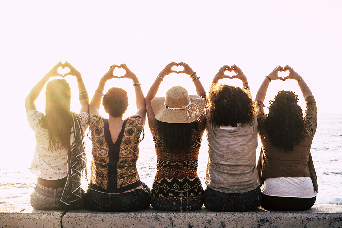 What is Perimenopause group of women sitting on a wall